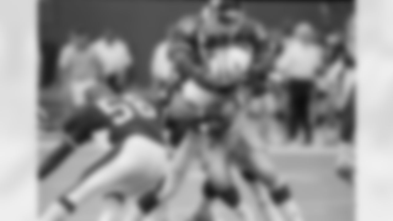 Detroit Lions Barry Sanders, carried for three yards before being brought down by Giants Erik Howard and Carl Banks, rear, in the second quarter at Giants Stadium, East Rutherford, N.J., Sept. 18, 1989. The Giants won 24-14. (AP Photo/Bill Kostroun)