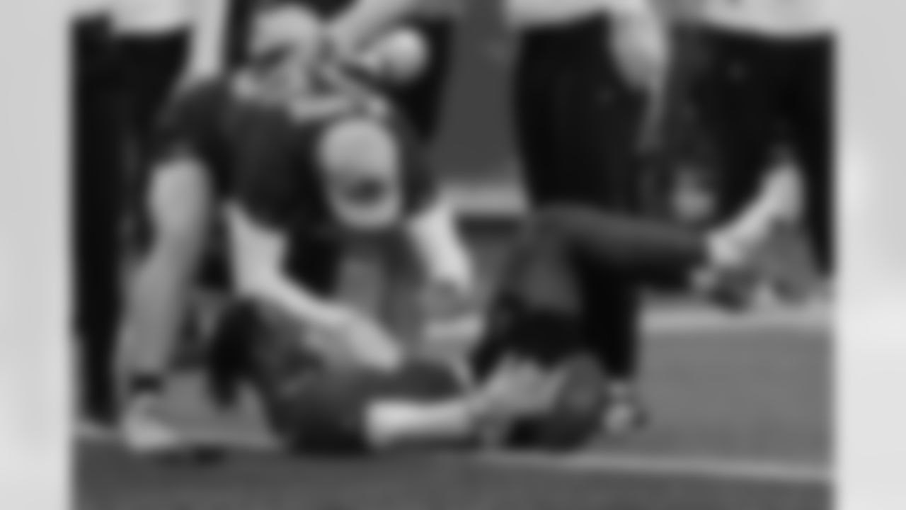 New York Giants receiver Malik Nabers, lower right, celebrates his touchdown reception with Arizona Cardinals tight end Trey McBride during the NFL Pro Bowl football game, Sunday, Feb. 2, 2025, in Orlando, Fla. (AP Photo/John Raoux)