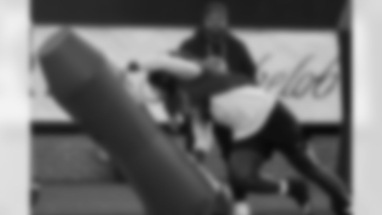 American Team defensive end Zion Young (9), of Missouri, runs through drills during practice for the Senior Bowl NCAA college football game Tuesday, Jan. 27, 2026, in Mobile, Ala. (AP Photo/Butch Dill)