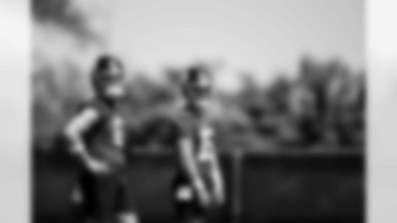 QB Jaxson Dart (6) and QB Tommy DeVito (15)