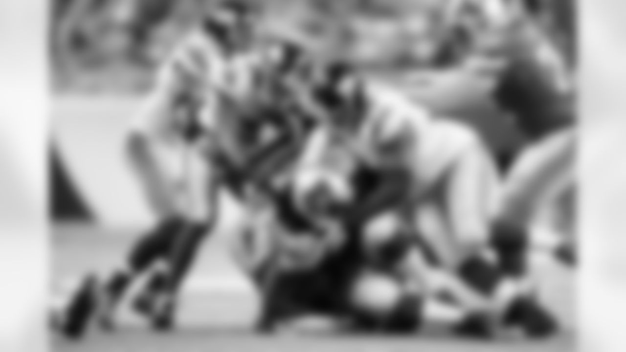 Detroit Lions running back Joique Bell (35) is tackled by New York Giants defensive tackle Mike Patterson (93) during an NFL football game at Ford Field in Detroit, Sunday, Dec. 22, 2013. (AP Photo/Rick Osentoski)