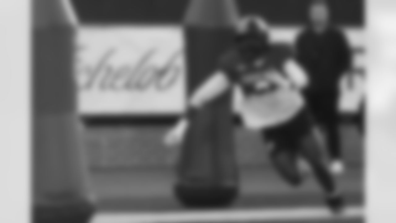 American Team defensive end Zion Young (9), of Missouri, runs through drills during practice for the Senior Bowl NCAA college football game Tuesday, Jan. 27, 2026, in Mobile, Ala. (AP Photo/Butch Dill)