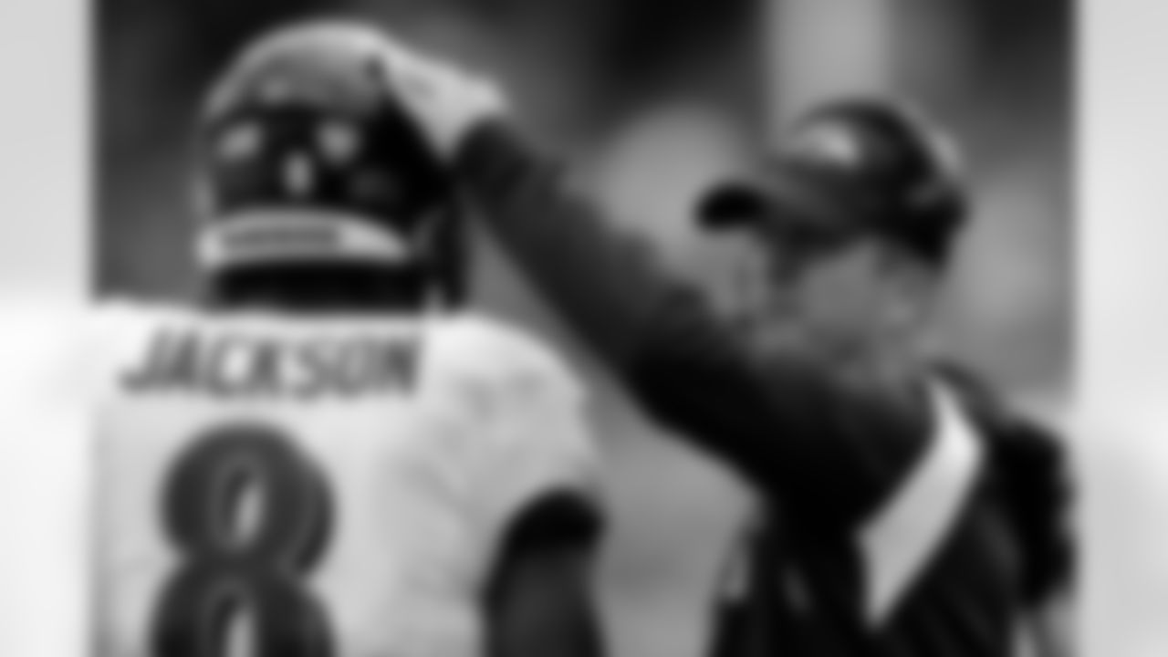 Baltimore Ravens head coach John Harbaugh pats Baltimore Ravens quarterback Lamar Jackson (8) on the helmet against the New York Giants during an NFL football game Sunday, Oct. 16, 2022, in East Rutherford, N.J. (AP Photo/Adam Hunger)