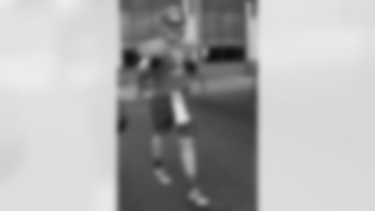 Tampa Bay Buccaneers quarterback Mike Kafka (3) walks to the field during NFL football training camp in Tampa, Fla., Friday, July 25, 2014.(AP Photo/Phelan M. Ebenhack)