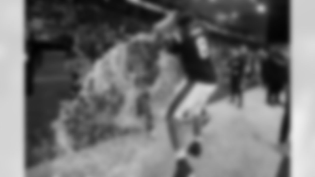 West's Myles Murphy (8), of North Carolina, douses head coach Mike Kafka, of the New York Giants, during the second half of the East West Shrine Bowl NCAA college football game in Frisco, Texas, Thursday, Feb. 1, 2024. (AP Photo/Julio Cortez)