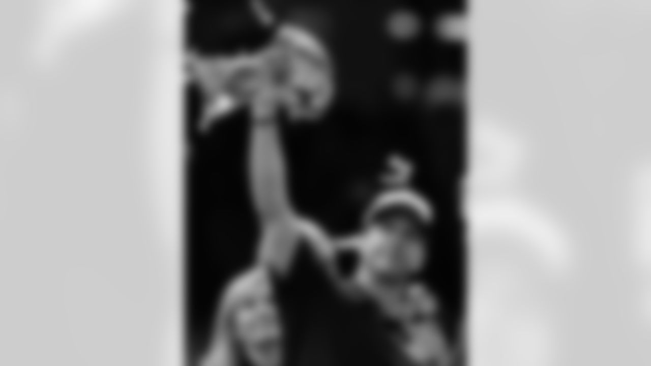 Baltimore Ravens head coach John Harbaugh holds up the Vince Lombardi Trophy after defeating the San Francisco 49ers 34-31 in the NFL Super Bowl XLVII football game, Sunday, Feb. 3, 2013, in New Orleans. (AP Photo/Julio Cortez)