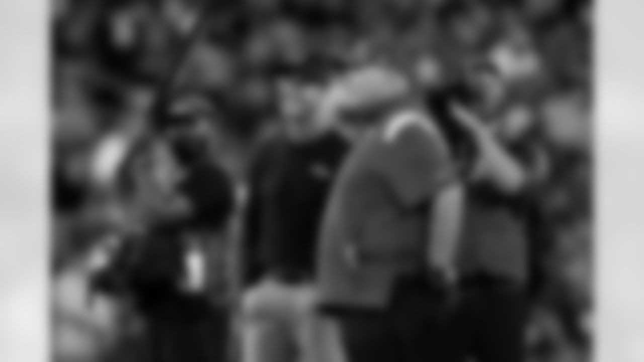 Baltimore Ravens head coach John Harbaugh, second from left, and Kansas City Chiefs head coach Andy Reid chat before an NFL football game, Sunday, Sept. 19, 2021, in Baltimore. (AP Photo/Julio Cortez)