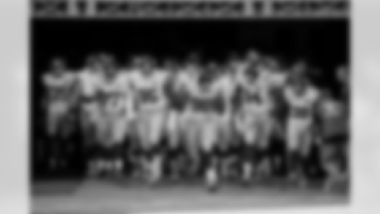 The New York Giants run onto the field before an NFL football game against the Detroit Lions in Detroit, Monday, Sept. 8, 2014. (AP Photo/Duane Burleson)