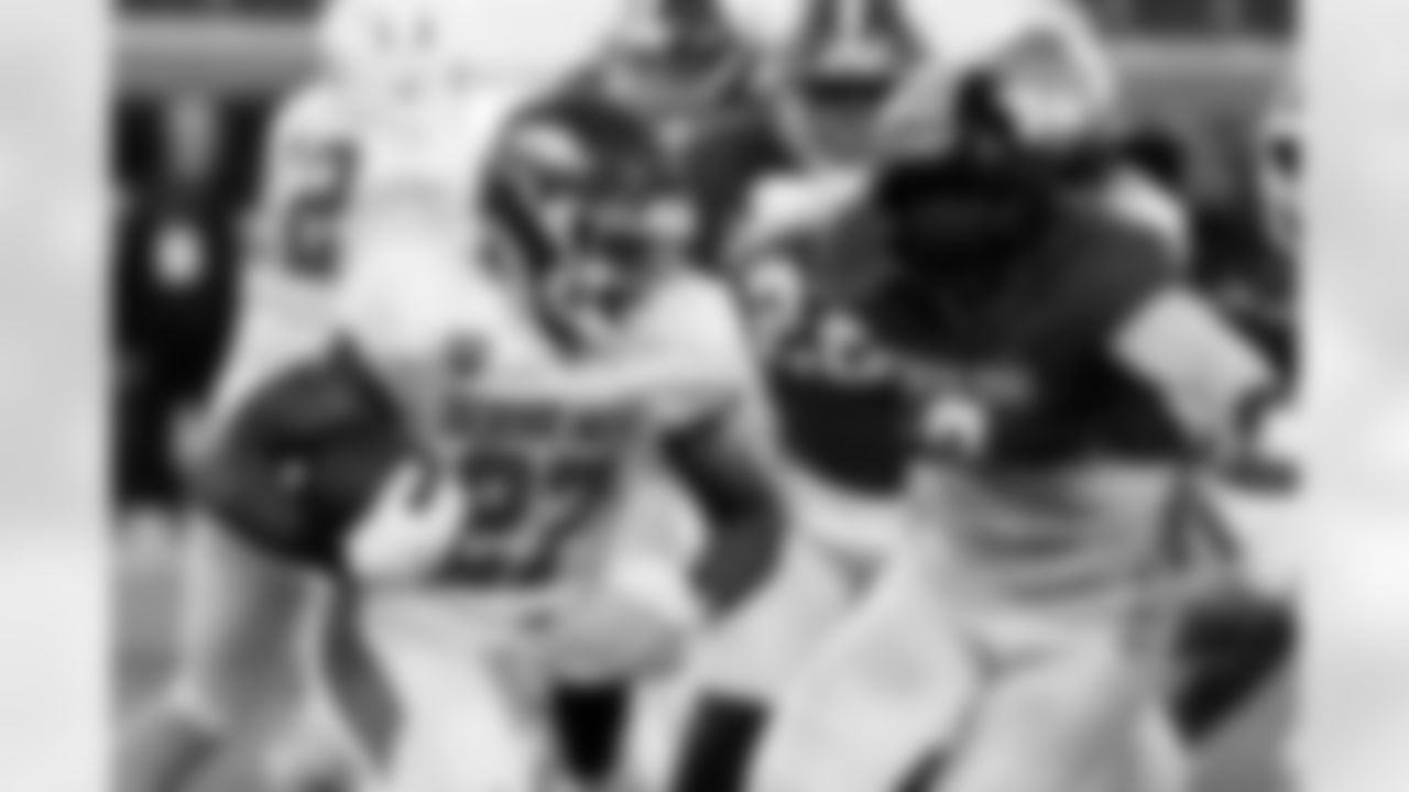 American Team running back Mike Washington Jr. (27), of Arkansas, carries the ball during practice for the Senior Bowl NCAA college football game Wednesday, Jan. 28, 2026, in Mobile, Ala. (AP Photo/Butch Dill)