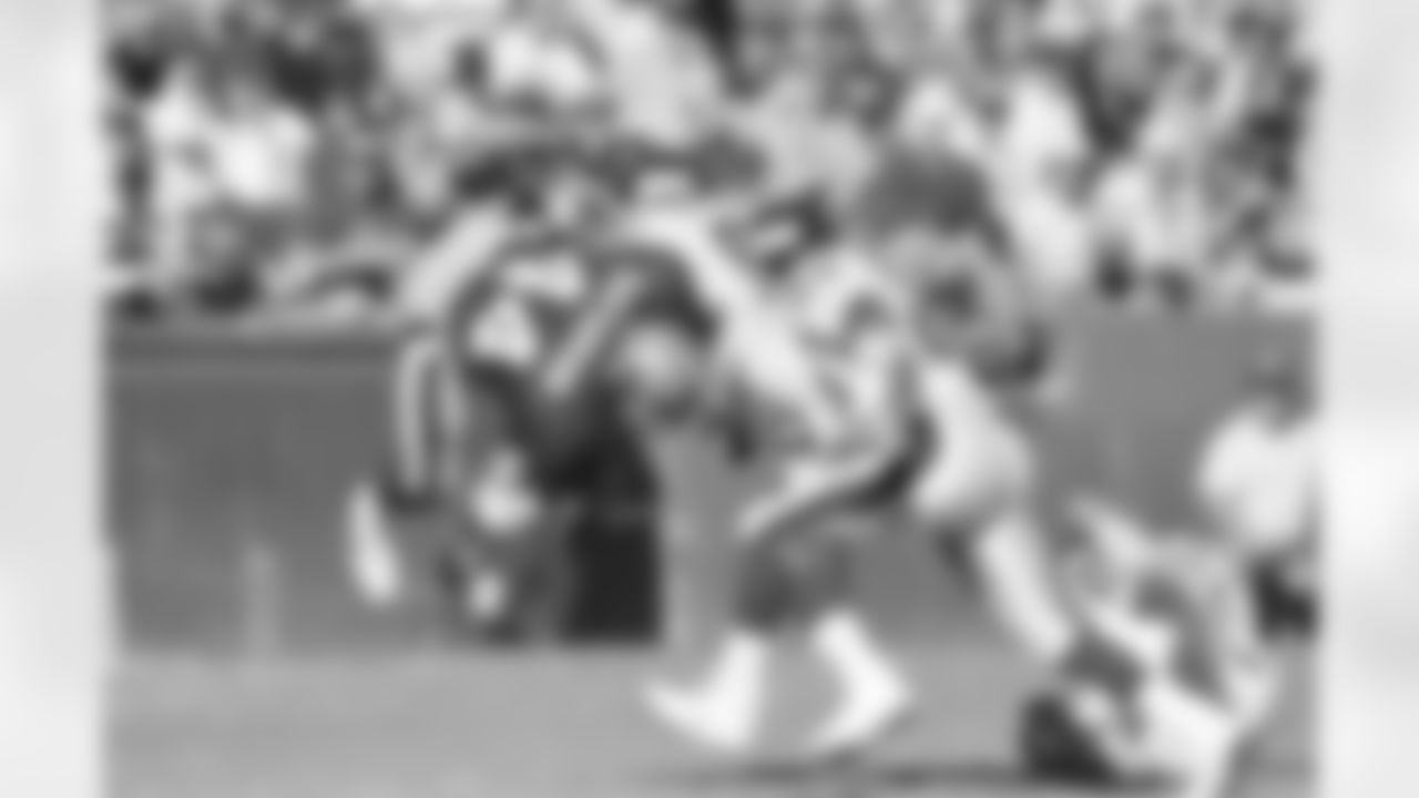 FILE --In a Jan. 20, 1991 file photo San Francisco 49ers Tom Rathman is upended by New York Giants Pepper Johnson (52) after receiving pass from quarterback Joe Montana in first quarter of NFC championship game in San Francisco. Giants Myron Guyton comes in at right. The two teams will meet again Sunday Jan. 22, 2012 to vie for the NFC championship. (AP Photo/Eric Risberg)