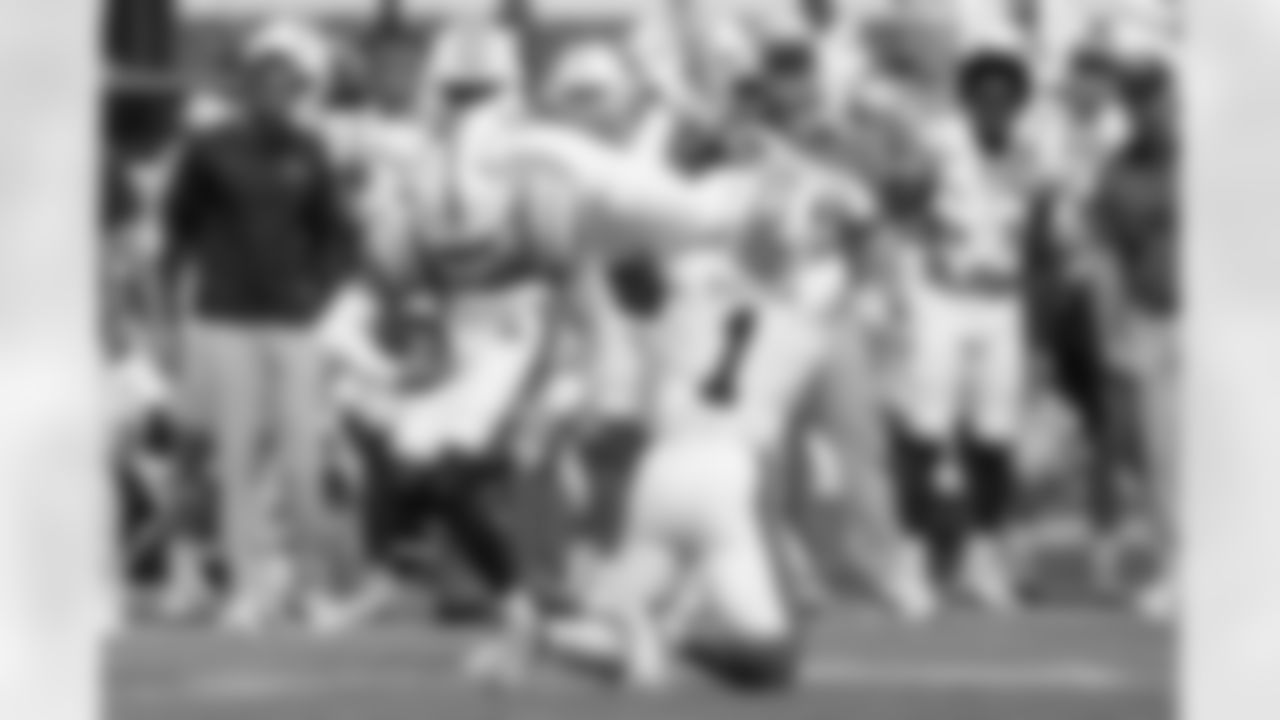 Mississippi quarterback Jaxson Dart (2) is upended by Auburn safety Donovan Kaufman (1) after a short run during the first half of an NCAA college football game in Oxford, Miss., Saturday, Oct. 15, 2022. (AP Photo/Rogelio V. Solis)