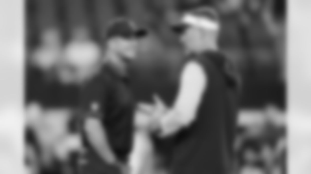 Baltimore Ravens head coach John Harbaugh, left, talks with Dallas Cowboys head coach Brian Schottenheimer, right, before their team's preseason NFL football game Saturday, Aug. 16, 2025, in Arlington, Texas. (AP Photo/LM Otero)