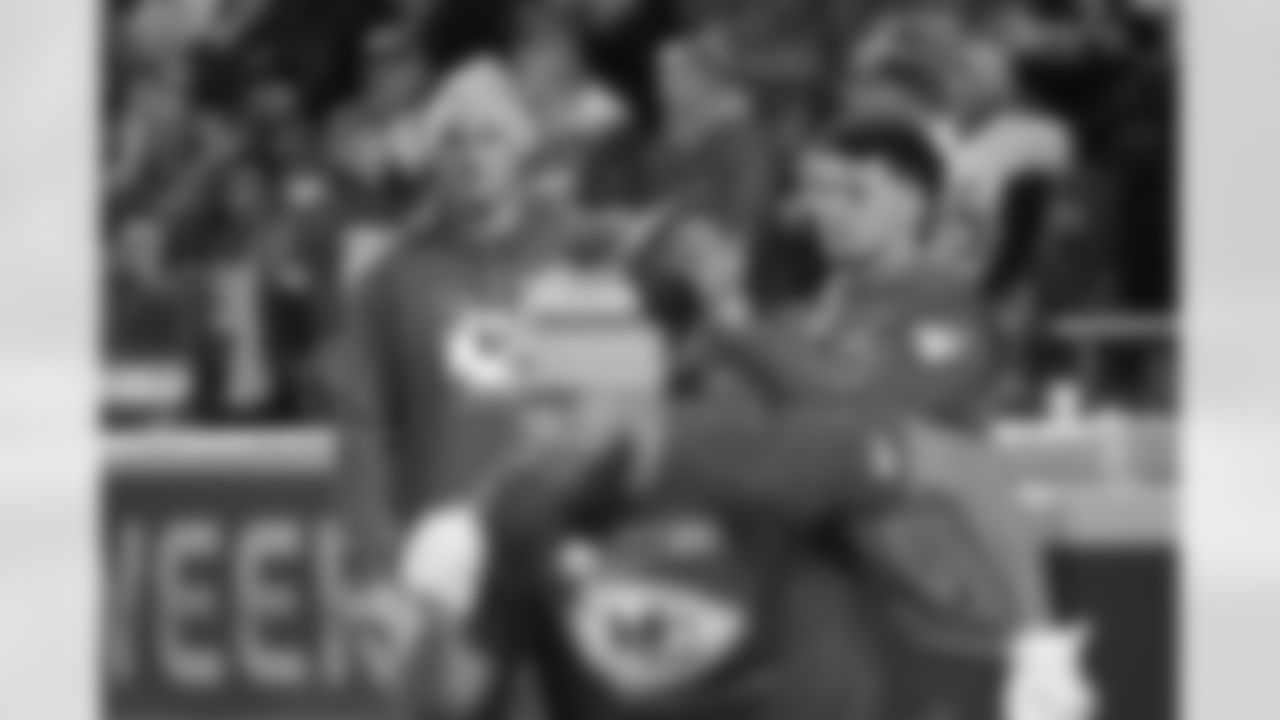 Kansas City Chiefs quarterbacks coach Mike Kafka, left, watches Patrick Mahomes during pre-game warmups before an NFL wild-card playoff football game against the Pittsburgh Steelers, Sunday, Jan. 16, 2022 in Kansas City, Mo. (AP Photos/Reed Hoffmann)