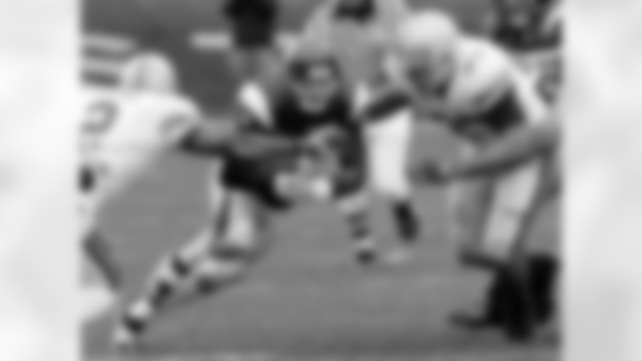 Northwestern quarterback Mike Kafka, center, carries the ball as Ohio State defenders Malcolm Jenkins, left, and Cameron Heyward, right, close in during the second half of an NCAA college football game in  Evanston, Ill., Saturday, Nov. 8, 2008. The Buckeyes won 45-10. (AP Photo/Charles Rex Arbogast)