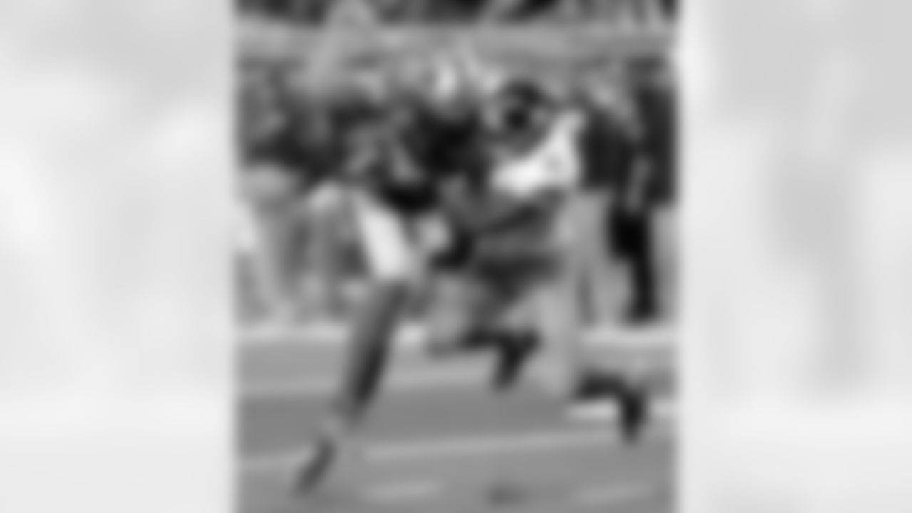 Detroit Lions wide receiver Calvin Johnson (81) is stopped by New York Giants free safety Ryan Mundy (21) during the first quarter of an NFL football game, Sunday, Dec. 22, 2013, in Detroit. (AP Photo/Carlos Osorio)