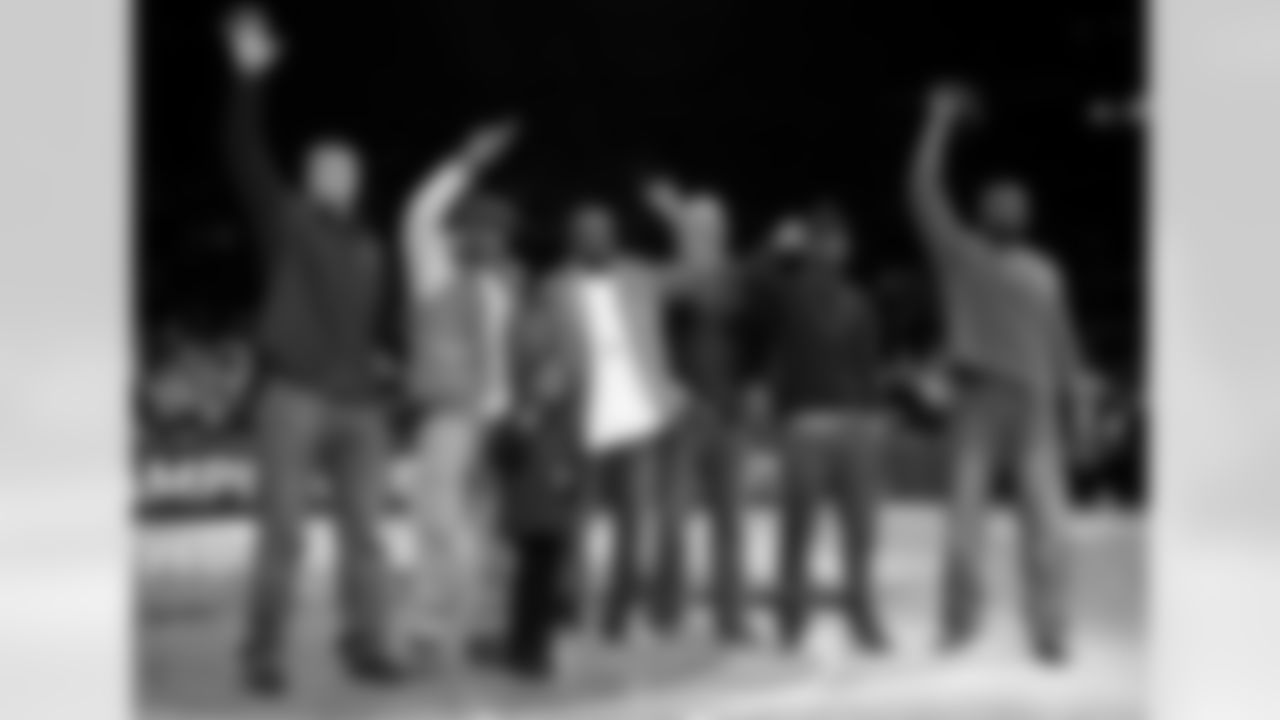 Members of the Super Bowl-champion New York Giants wave as they are introduced during a timeout in the NBA basketball game between the Utah Jazz and the New York Knicks on Monday, Feb. 6, 2012, in New York. From left are Bear Pascoe, Corey Webster, Hakeem Nicks, Mark Herzlich, Aaron Ross and Mathias Kiwanuka. (AP Photo/Kathy Kmonicek)