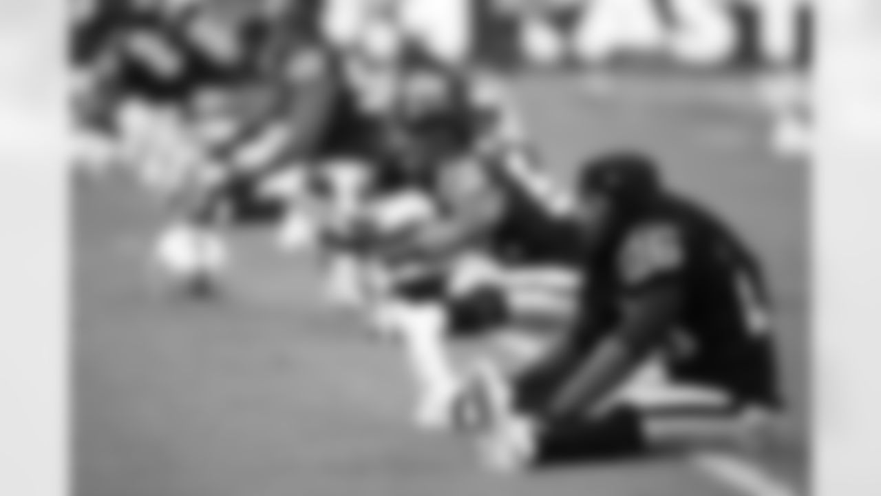 Oakland Raiders' Usama Young stretches before an NFL football game against the Miami Dolphins, Sunday, Sept. 28, 2014, at Wembley Stadium in London. (AP Photo/Lefteris Pitarakis)