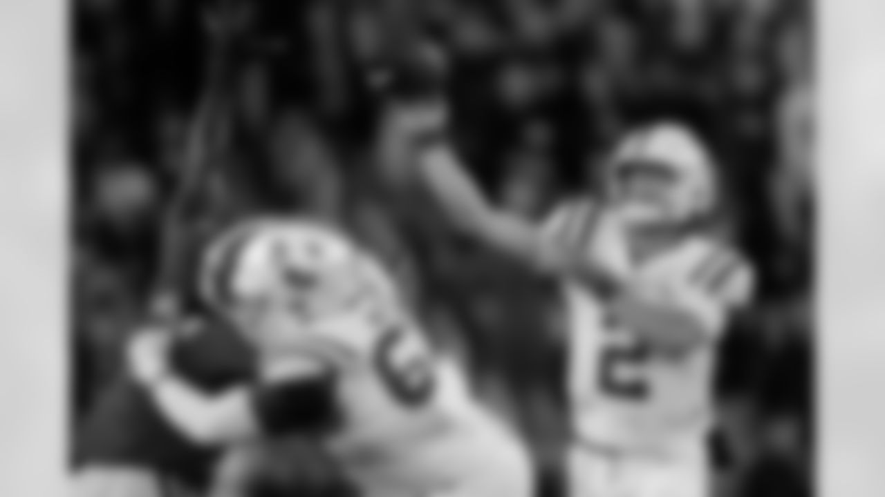 Mississippi quarterback Jaxson Dart (2) throws as offensive lineman Quincy McGee (67) blocks Georgia defensive lineman Tramel Walthour (90) during the first half of an NCAA college football game, Saturday, Nov. 11, 2023, in Athens, Ga. (AP Photo/John Bazemore)