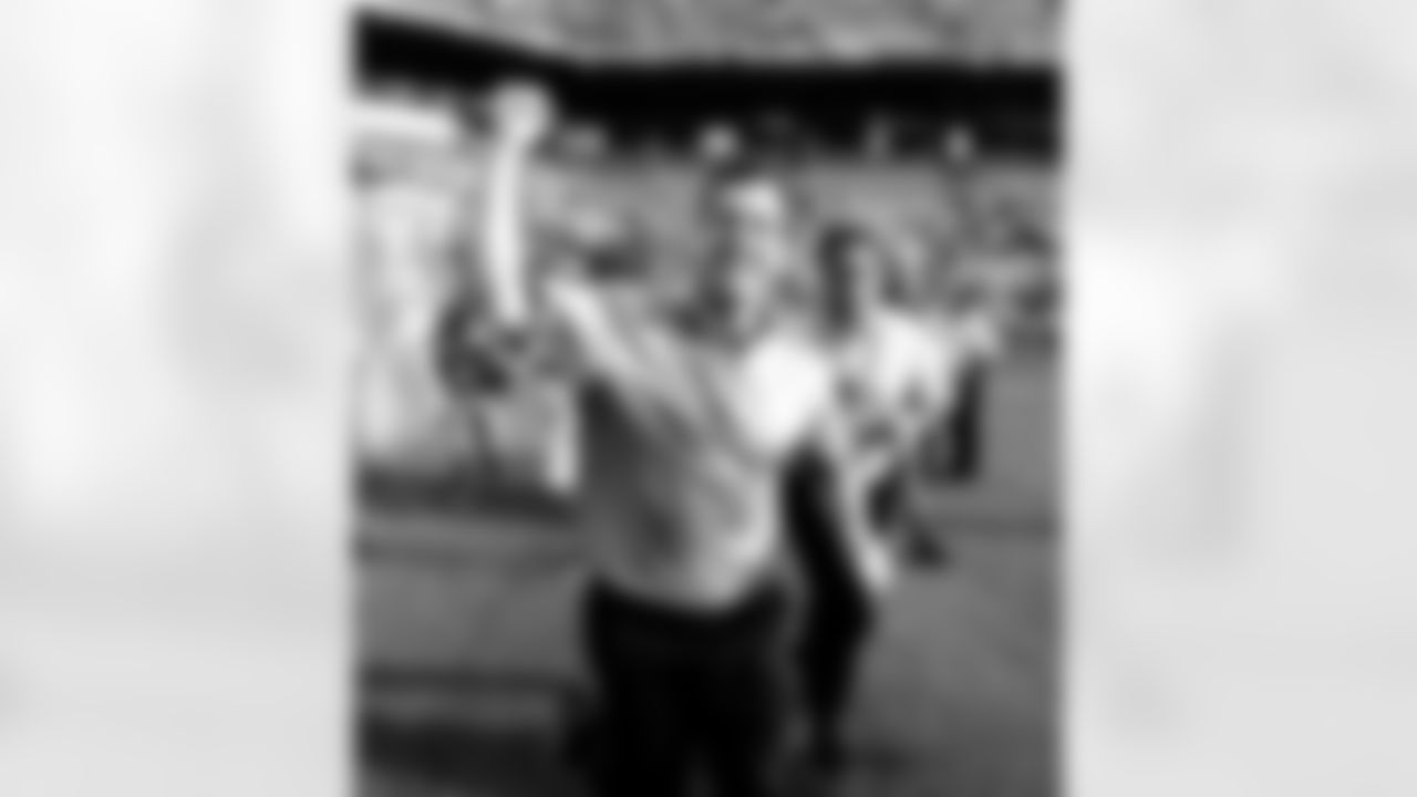 Baltimore Ravens football coach John Harbaugh celebrates their 27-9 NFL football playoff victory over the Miami Dolphins in Miami, Sunday, Jan. 4, 2009. (AP Photo/J. Pat Carter)