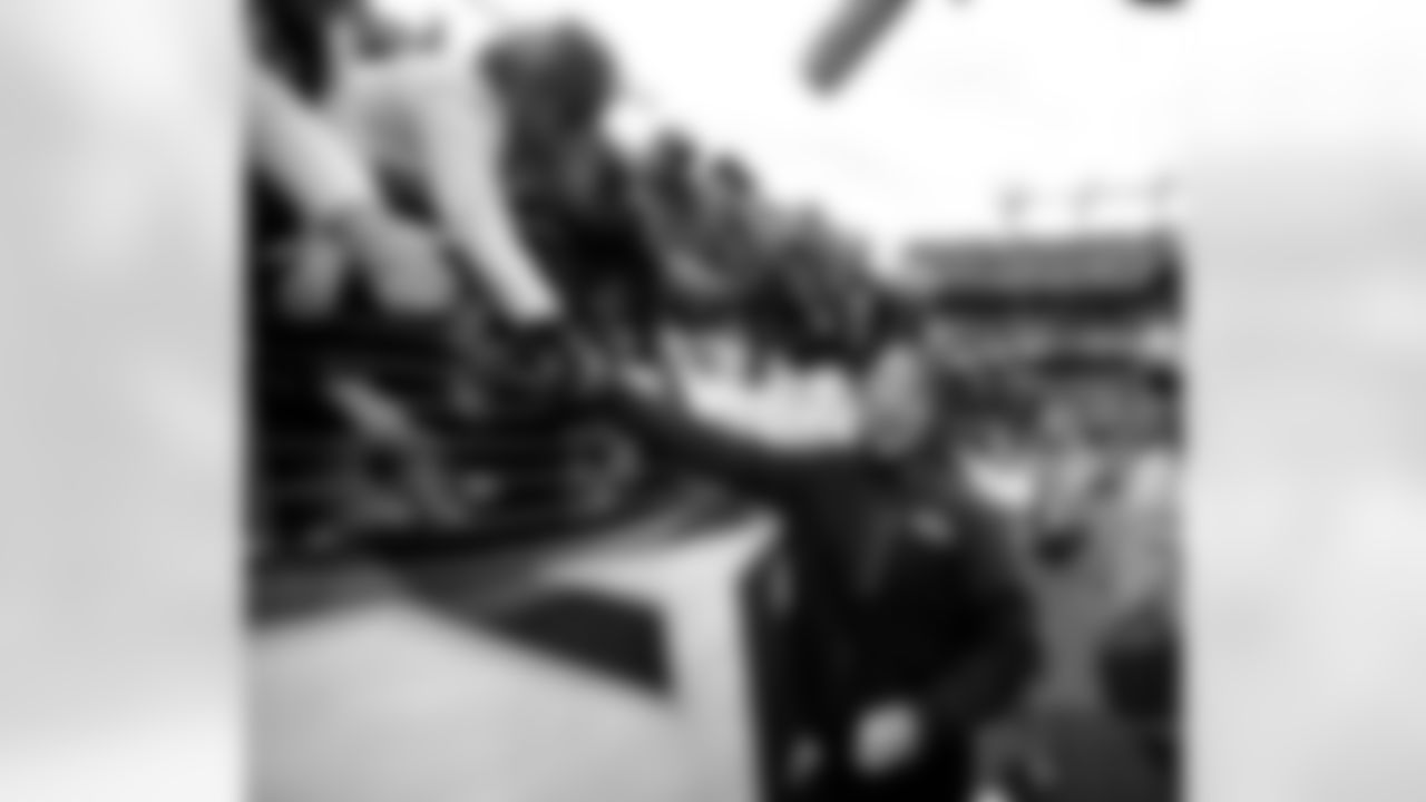 Baltimore Ravens head coach John Harbaugh greets fans after an NFL wild card playoff football game against the Indianapolis Colts Sunday, Jan. 6, 2013, in Baltimore. The Ravens won 24-9. (AP Photo/Nick Wass)