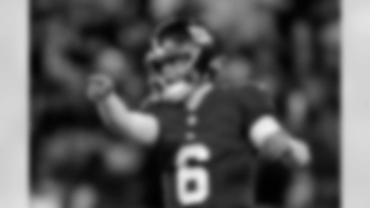 New York Giants quarterback Jaxson Dart (6) reacts after a touchdown during the second half of an NFL football game against the Philadelphia Eagles, Thursday, Oct. 9, 2025, in East Rutherford, N.J. (AP Photo/Adam Hunger)