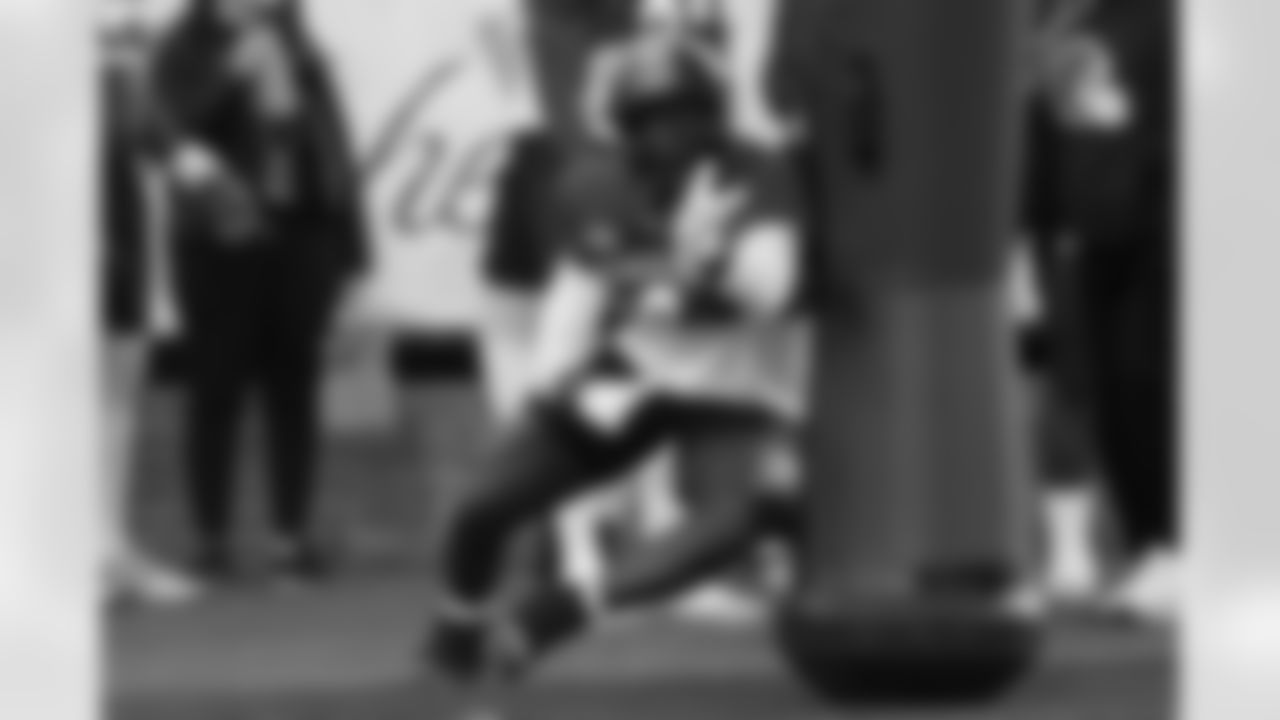 American Team defensive end Zion Young (9), of Missouri, runs through drills during practice for the Senior Bowl NCAA college football game Tuesday, Jan. 27, 2026, in Mobile, Ala. (AP Photo/Butch Dill)