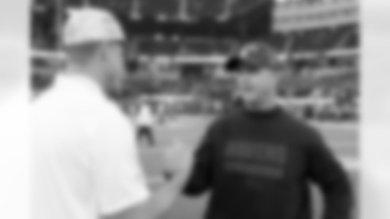 Los Angeles Chargers head coach Jim Harbaugh and Baltimore Ravens head coach John Harbaugh interact for a photo prior to an NFL football game on Monday, November 25, 2024 in Inglewood, Calif. The Ravens defeated the Chargers, 30-23. (Ben Liebenberg via AP)