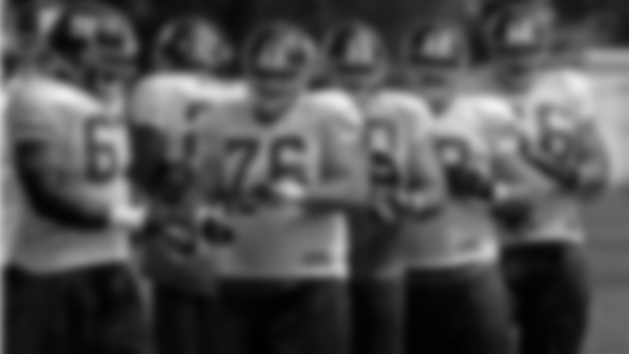 New York Giants offensive linemen Kareem McKenzie (67), Chris Snee (76), Shaun O'Hara (60), Rich Seubert (69), and David Diehl (66) break huddle during football training camp in Albany, N.Y., Monday, July 28, 2008. (AP Photo/Mike Groll)