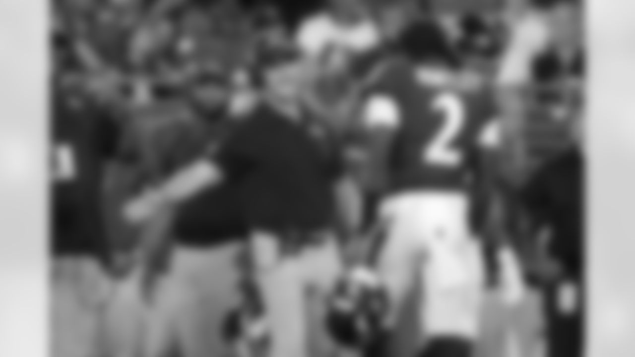 Baltimore Ravens head coach John Harbaugh, middle, greets quarterback Tyler Huntley (2) during the second half of an NFL preseason football game against the Philadelphia Eagles in Baltimore, Saturday, Aug. 12, 2023. (AP Photo/Julio Cortez)