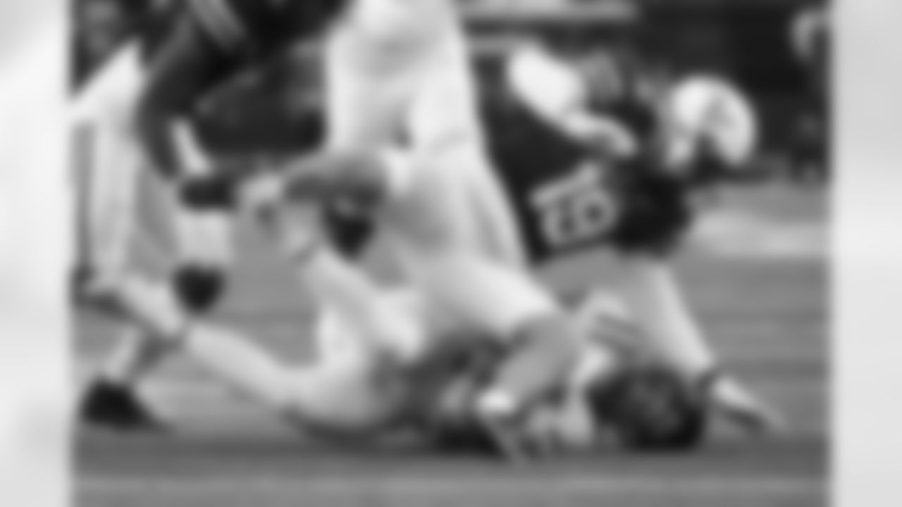 Vanderbilt linebacker Kane Patterson (19) brings down Mississippi quarterback Jaxson Dart during the second half of an NCAA college football game Saturday, Oct. 8, 2022, in Nashville, Tenn. Mississippi won 52-28. (AP Photo/John Amis)