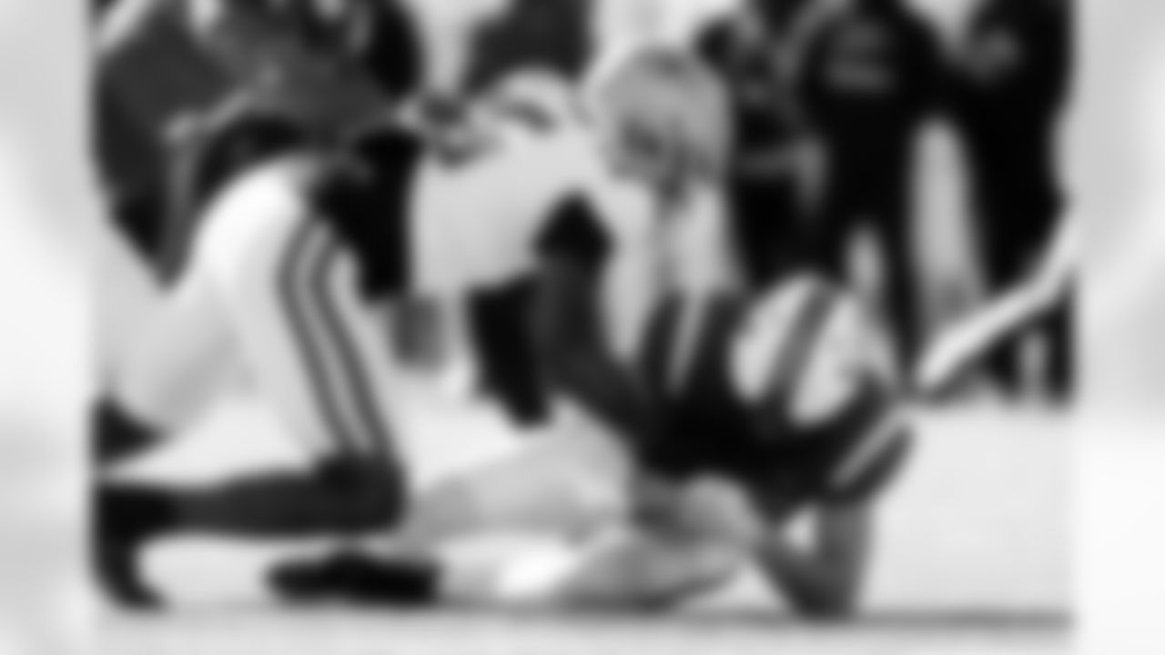 National Team quarterback Diego Pavia, bottom, of Vanderbilt, is sacked by American Team defensive end Quintayvious Hutchins (15), of Boston College, during the first half of the Senior Bowl NCAA college football game Saturday, Jan. 31, 2026, in Mobile, Ala. (AP Photo/Butch Dill)