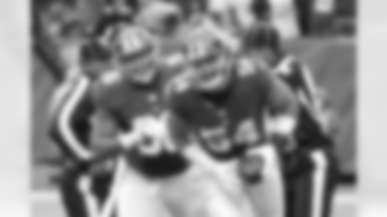 New York Giants defensive end Olivier Vernon (54) celebrates with teammate Jay Bromley (96) after recovering a fumble during the first half of an NFL football game against the Detroit Lions Sunday, Dec. 18, 2016, in East Rutherford, N.J. (AP Photo/Bill Kostroun)