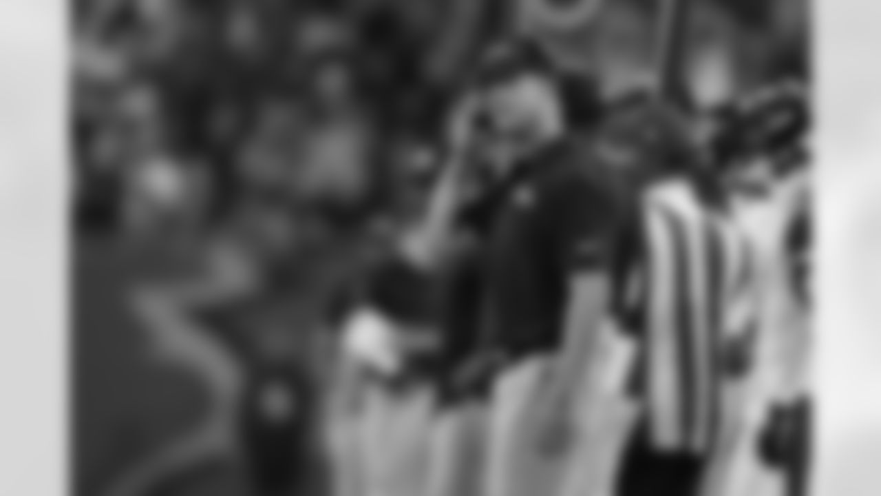 Baltimore Ravens head coach John Harbaugh chats on his headset while watching a replay during an NFL preseason football game against the Tampa Bay Buccaneers, Saturday, Aug. 26, 2023, in Tampa, Fla. (AP Photo/Peter Joneleit)
