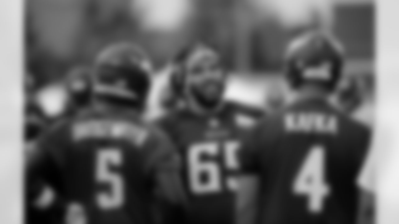 Minnesota Vikings center John Sullivan (65) talks to quarterbacks Teddy Bridgewater and Mike Kafka, during practice at an NFL football training camp on the campus of Minnesota State University Monday, July 27, 2015, in Mankato, Minn. (AP Photo/Charles Rex Arbogast)