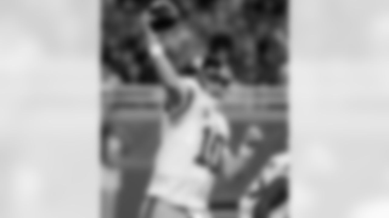 New York Giants quarterback Eli Manning (10) throws during the first quarter of an NFL football game against the Detroit Lions in Detroit, Sunday, Dec. 22, 2013. (AP Photo/Duane Burleson)