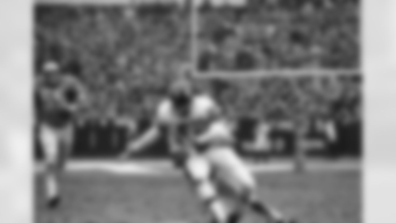 Bob Crespino, No. 89, New York Giants end, is tackled by Tom Vaughn, No. 48, of the Detroit Lions after taking a pass from quarterback Fran Tarkenton for a first down in first period of National Football League game at Yankee Stadium on Dec. 10, 1967 in New York. (AP Photo/Harry Harris)