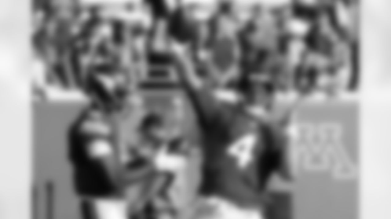 Minnesota Vikings quarterback Mike Kafka (4) throws next to Teddy Bridgewater, left, during warmups before a preseason NFL football game against the Tampa Bay Buccaneers at TCF Bank Stadium Saturday, Aug. 15, 2015, in Minneapolis. (AP Photo/Ann Heisenfelt)