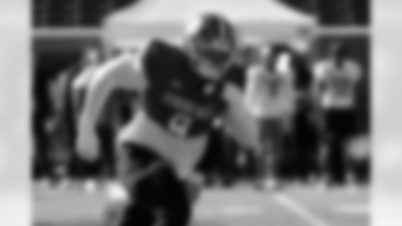 National Team defensive end TJ Parker (9) runs through drills during practice for the Senior Bowl NCAA college football game Tuesday, Jan. 27, 2026, in Mobile, Ala. (AP Photo/Butch Dill)