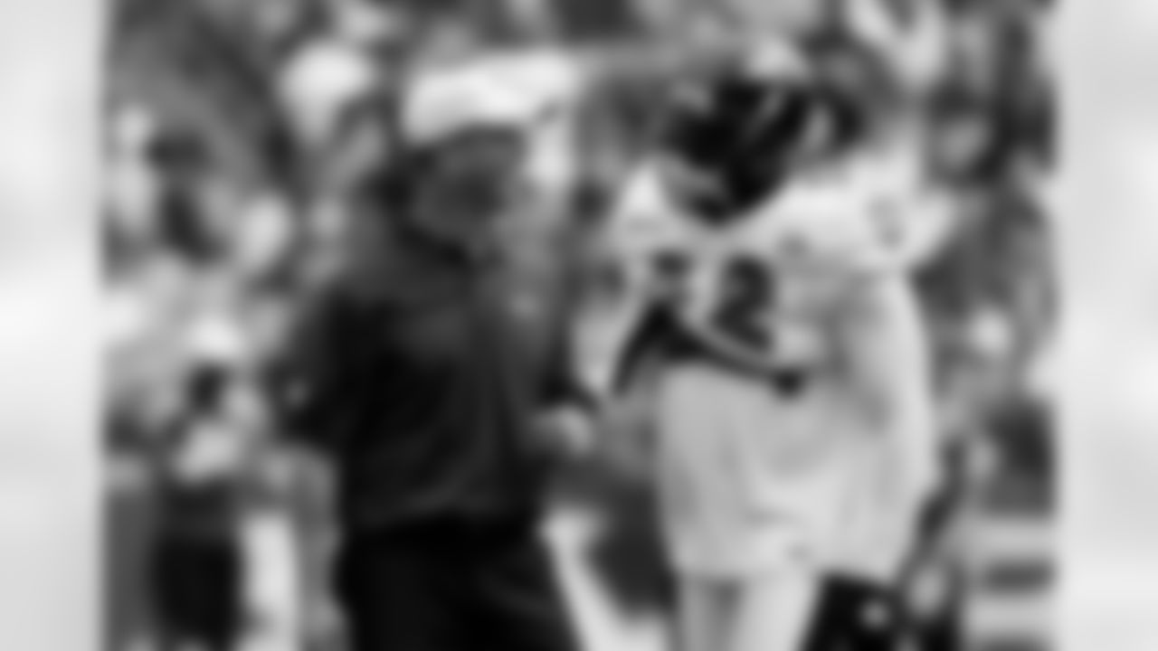 Baltimore Ravens head coach John Harbaugh shares a light moment with linebacker Ray Lewis during NFL football training camp in Baltimore, Saturday, Aug. 6, 2011. (AP Photo/Patrick Semansky)