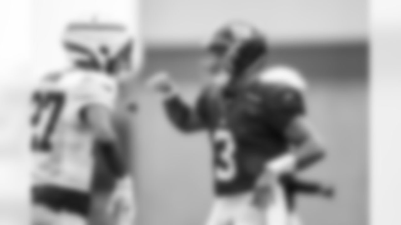 S Tyler Nubin (27) and QB Russell Wilson (3)