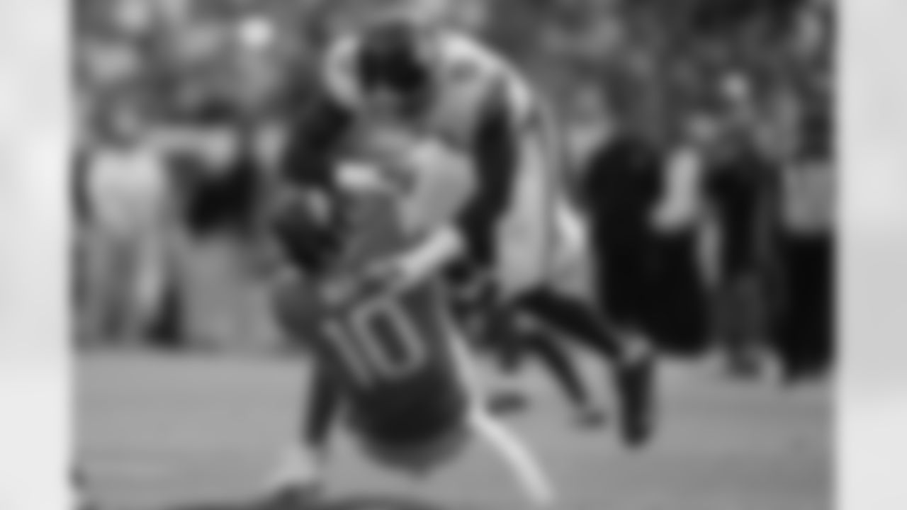 Denver Broncos quarterback Bo Nix (10) is sacked by New York Giants linebacker Brian Burns (0) during the first half of an NFL football game in Denver, Sunday, Oct. 19, 2025. (AP Photo/Jack Dempsey)