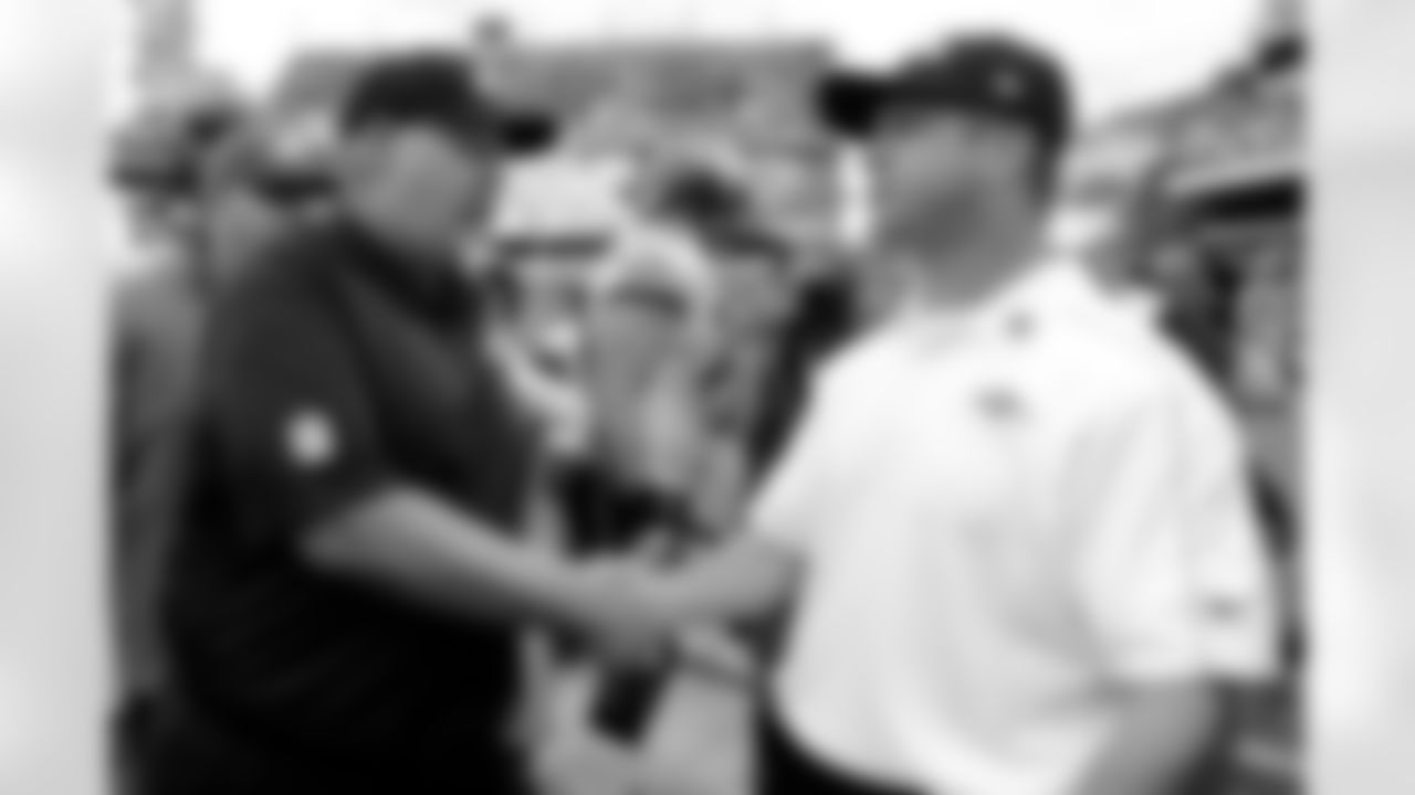 Philadelphia Eagles head coach Andy Reid, left, and Baltimore Ravens head coach John Harbaugh shake hands after an NFL football game on Sunday, Sept. 16, 2012, in Philadelphia. Philadelphia won 24-23. (AP Photo/Michael Perez)