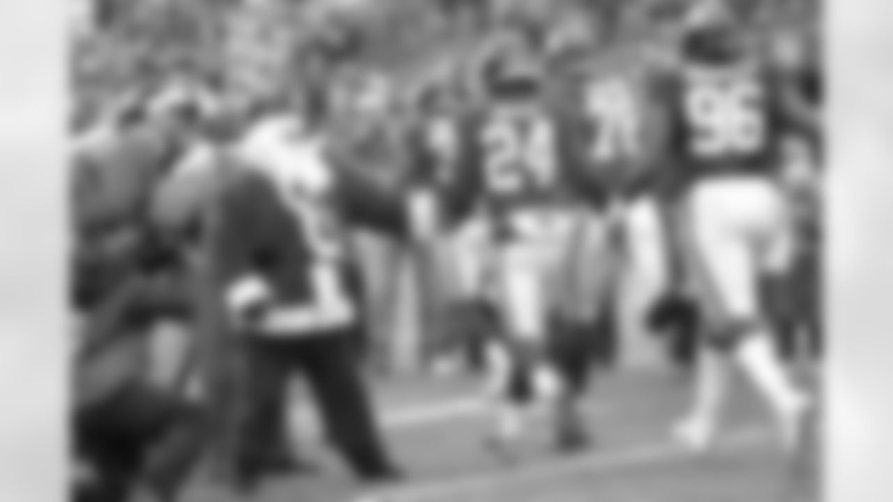 A man dressed as Santa Clause greets New York Giants' Eli Apple (24) and teammates before an NFL football game against the Detroit Lions Sunday, Dec. 18, 2016, in East Rutherford, N.J. (AP Photo/Bill Kostroun)