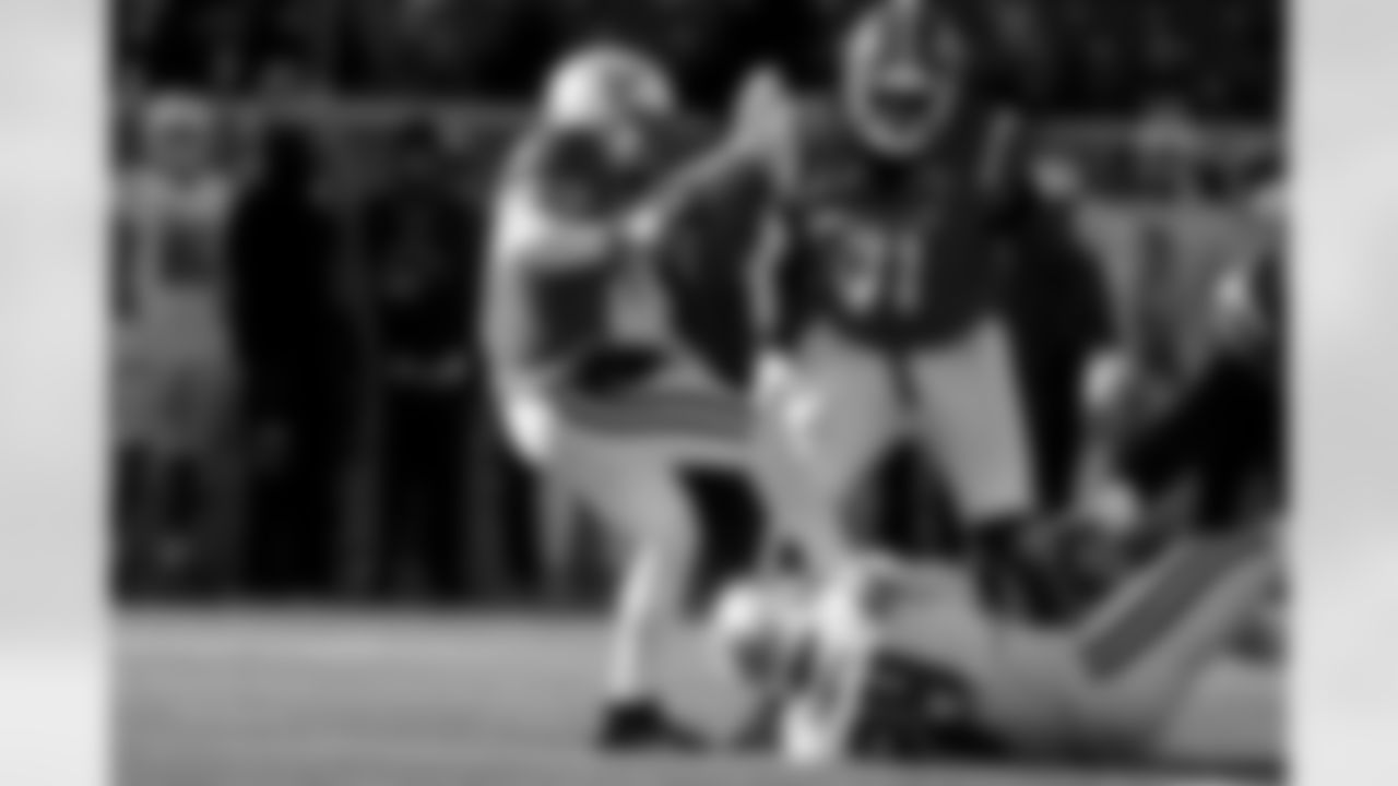 National Team quarterback Diego Pavia, left, of Vanderbilt, is sacked by American Team outside linebacker Keyron Crawford, bottom, of Auburn, during the second half of the Senior Bowl NCAA college football game Saturday, Jan. 31, 2026, in Mobile, Ala. (AP Photo/Butch Dill)