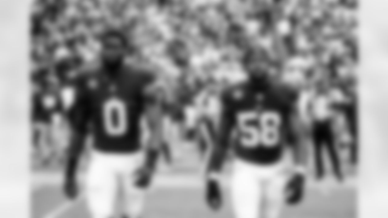 OLB Brian Burns (0)  and ILB Bobby Okereke (58)