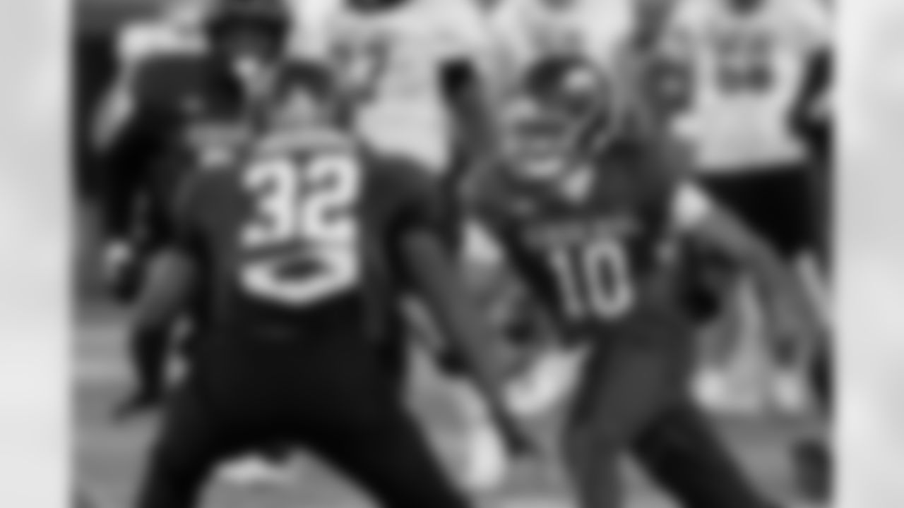 American Team quarterback Taylen Green (10), of Arkansas, caries the ball during practice for the Senior Bowl NCAA college football game Tuesday, Jan. 27, 2026, in Mobile, Ala. (AP Photo/Butch Dill)