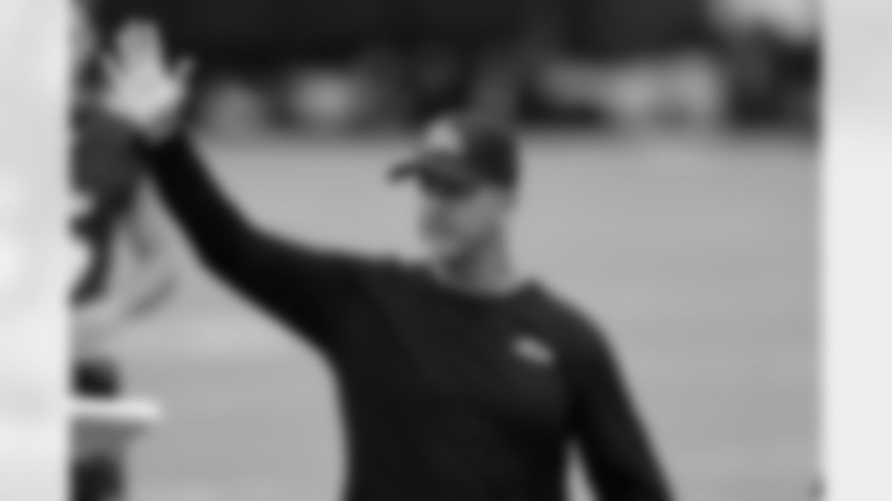 Baltimore Ravens head coach John Harbaugh waves to fans after an NFL football practice, Monday, Aug. 16, 2021, in Owings Mills, Md.(AP Photo/Gail Burton)