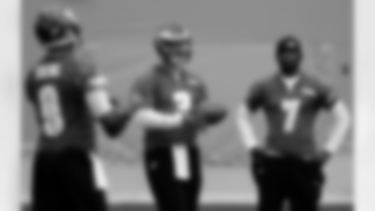 Philadelphia Eagles quarterbacks, from left, Vince Young, Mike Kafka, and Michael Vick, stand during an indoor practice at their NFL football training facility, Wednesday, Nov. 16, 2011 in Philadelphia. (AP Photo/Alex Brandon)