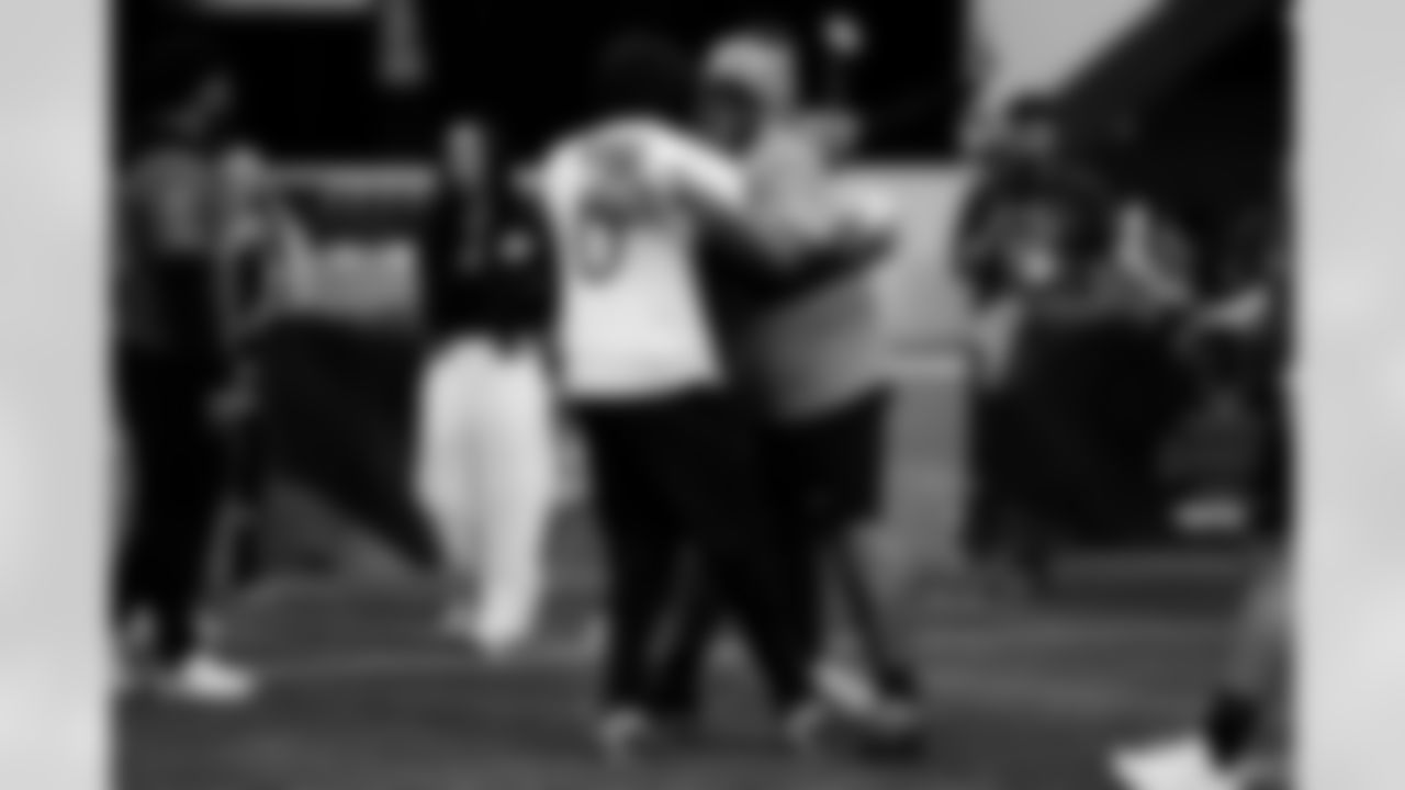 Buffalo Bills offensive tackle Dion Dawkins (73) hugs New York Giants linebacker Brian Burns (0)  during the 2026 Pro Bowl Skills Challenge on Monday, February 2, 2026 in San Francisco. (Kara Durrette/NFL)