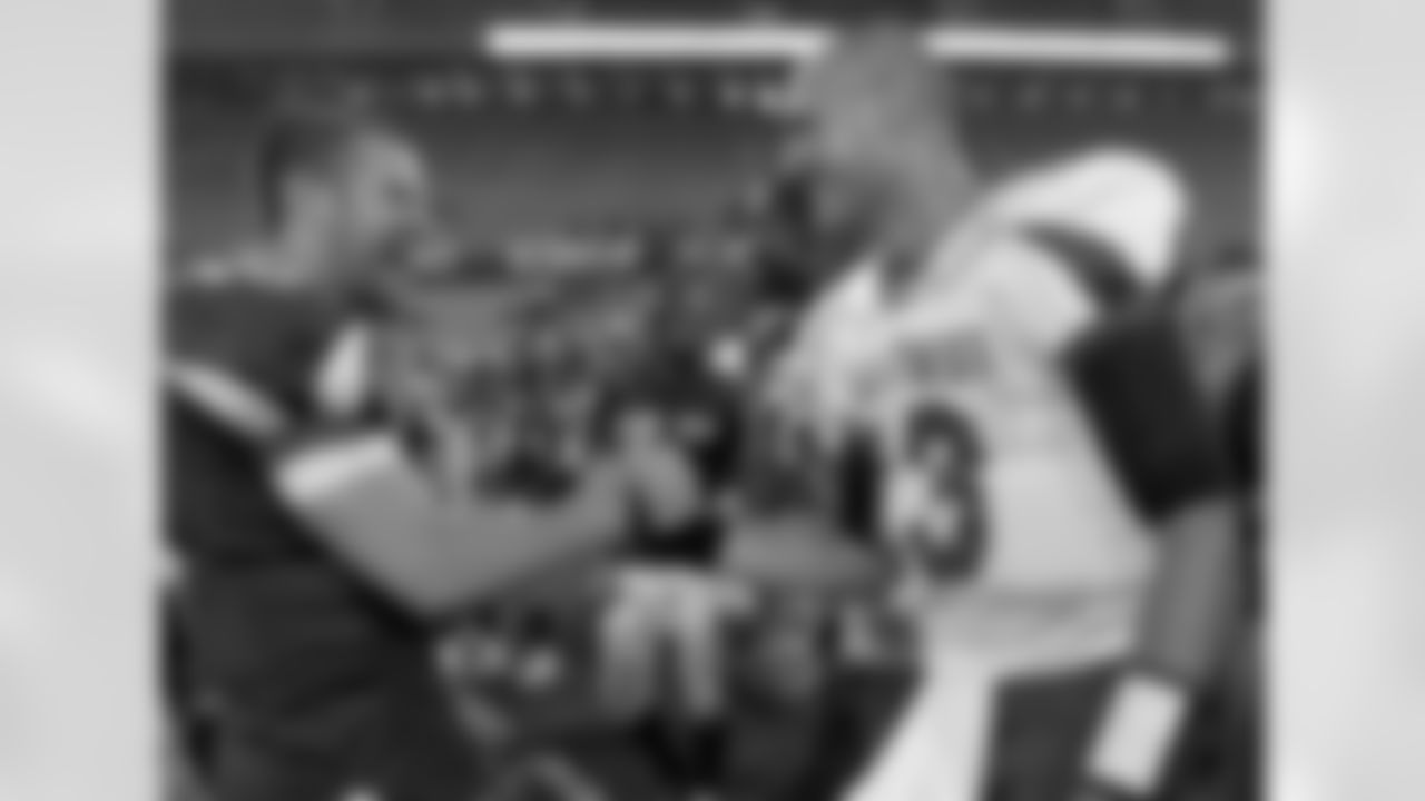 West quarterback Max Hall, left, of BYU, congratulates East quarterback Mike Kafka, of Northwestern, after the East West Shrine football game in Orlando, Fla., Saturday, Jan. 23, 2010.  The East won 13-10. (AP Photo/Phelan M. Ebenhack)